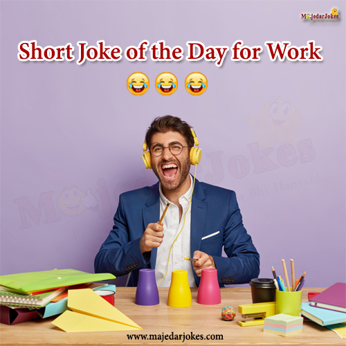 Coworkers laughing at a clean office joke during coffee break